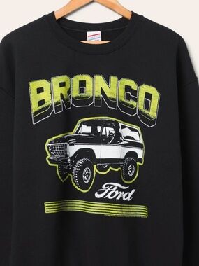 Junk Food Clothing Black Crewneck Sweatshirt with Lime Bronco Graphic